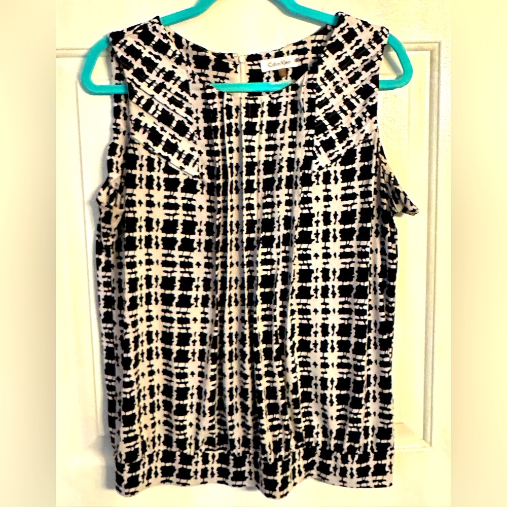 Women’s Calvin Klein,L, sleeveless black & white blouse. Gently used. Smoke free